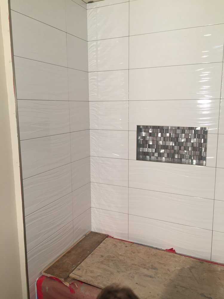 Tile work in a mobile home bathroom remodel