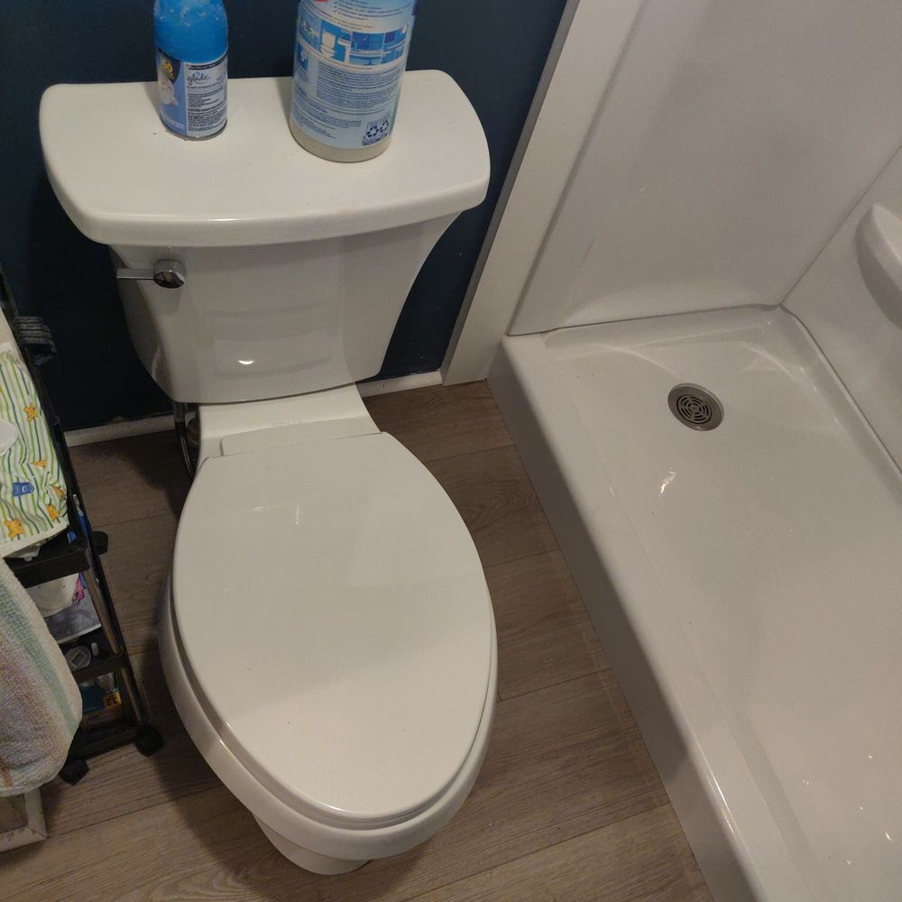 Toilet installation in a mobile home bathroom remodel