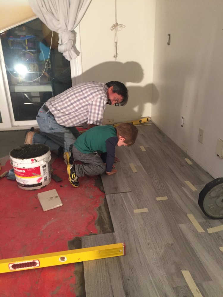Laminate wood-look flooring being installed in a mobile home