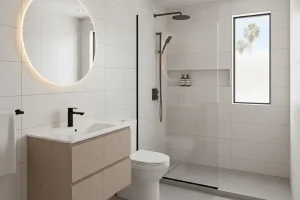 Modern mobile home bathroom remodel in Huntington Beach with walk-in glass shower, floating vanity, and space-saving layout for improved comfort and storage