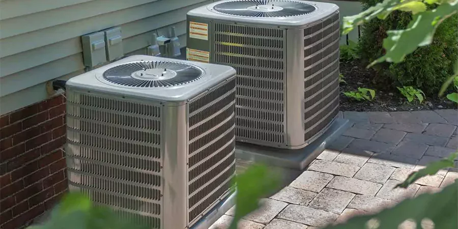 Outdoor central air conditioning units beside a mobile home in Riverside, CA—showing common HVAC setup for residential cooling.